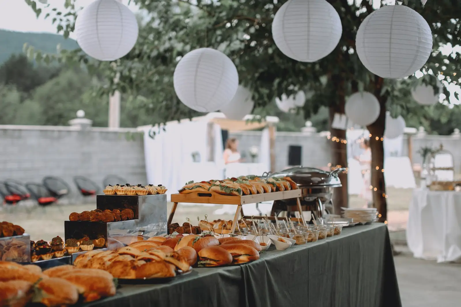 Outdoor buffet with sandwiches and pastries