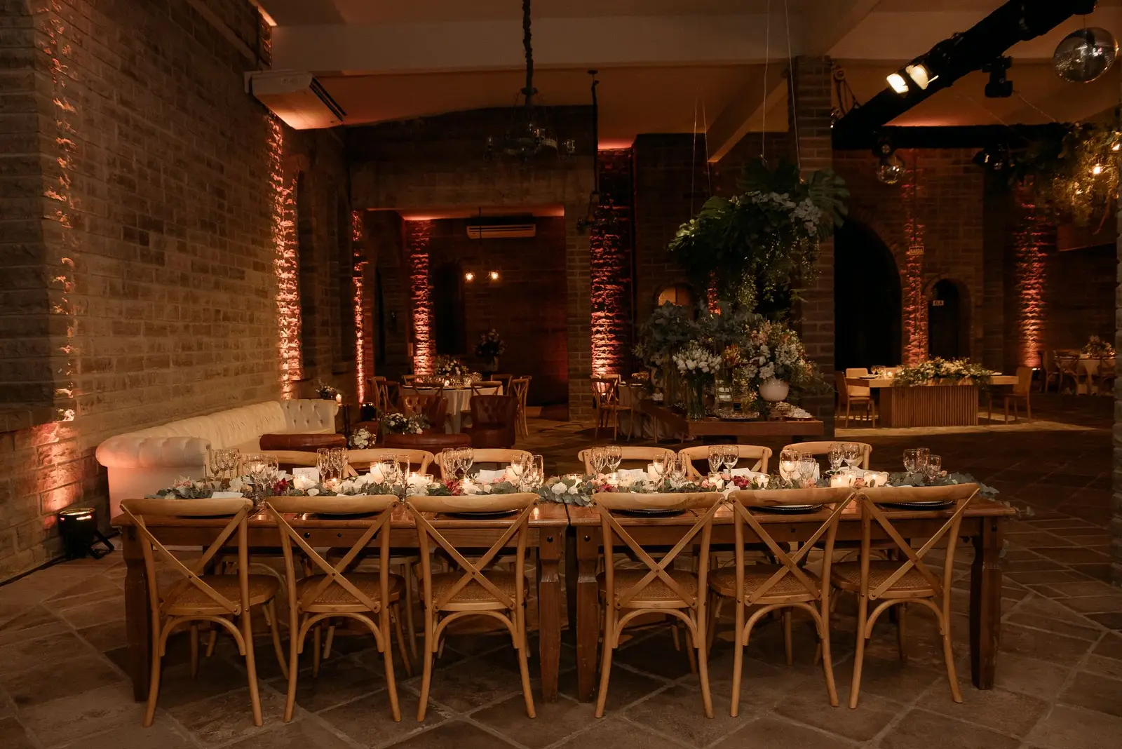 Brick event room with wooden tables