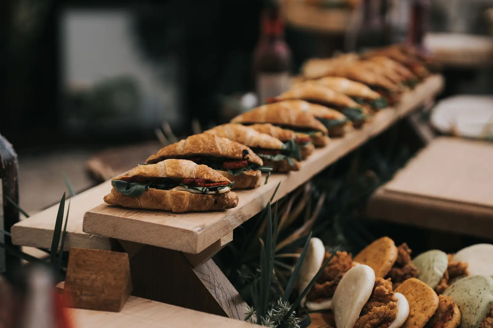 Croissant sandwiches on a wooden board