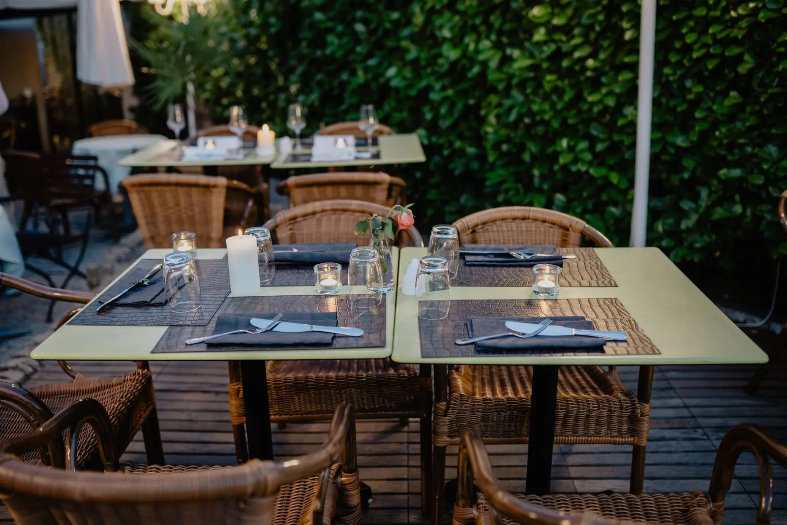 Candlelit terrace tables at dusk